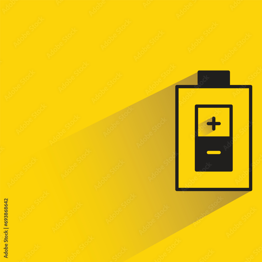 battery with shadow on yellow background battery with shadow on yellow background