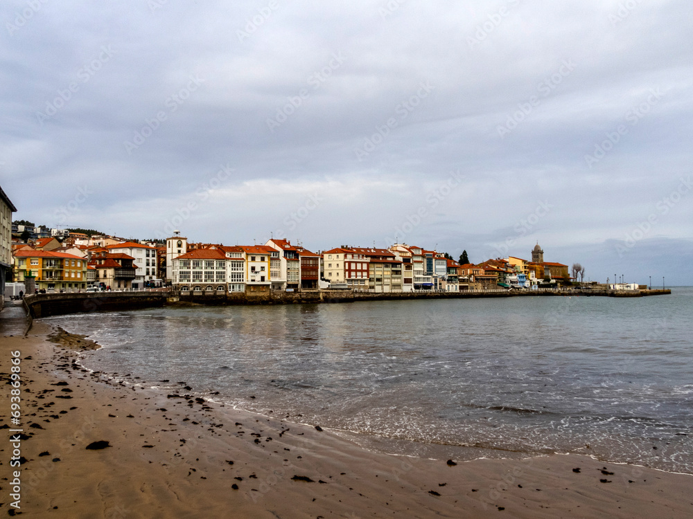 Old dock area in the town of Luanco from La Ribera beach. Asturias, Spain.