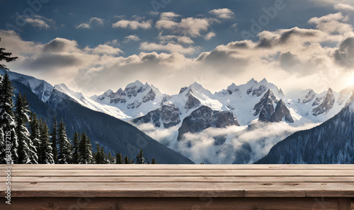 Winter serenity: Empty wooden table with snowy mountain backdrop