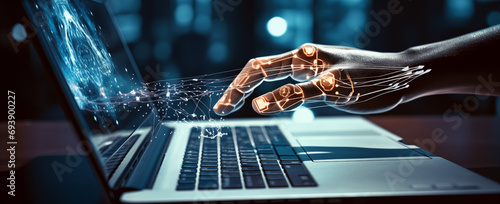 Futuristic Cyber hand using laptop and typing keyboard. Technology in future. Writing programming codes