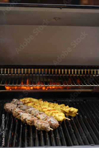 Assorted barbecue skewers meat kebabs on flaming grill