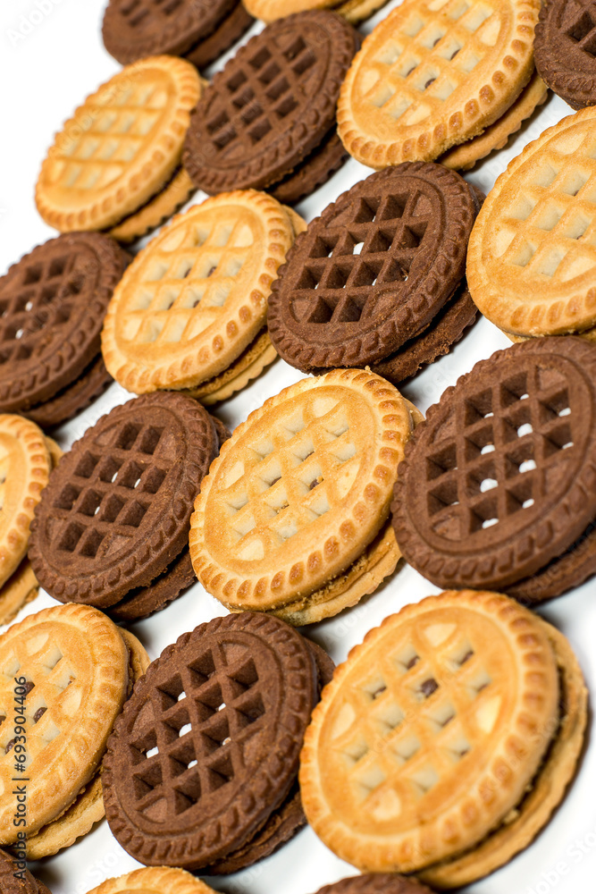 Chocolate and vanilla round cookies on a white background, round cookies on a white background Chocolate and vanilla round cookies on a white background, round cookies on a white background