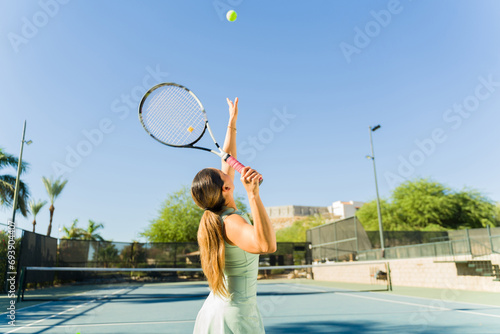 Hispanic young women exercising playing tennis