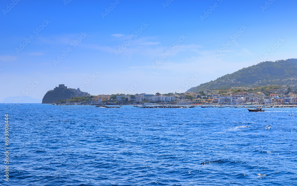 Iconic view of Ischia Island in Italy. Townscape of Ischia Ponte from sea.	
