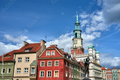 Historic tenement houses, a statue of Apollo and the tower of the Renaissance town hall on the market square in Poznan