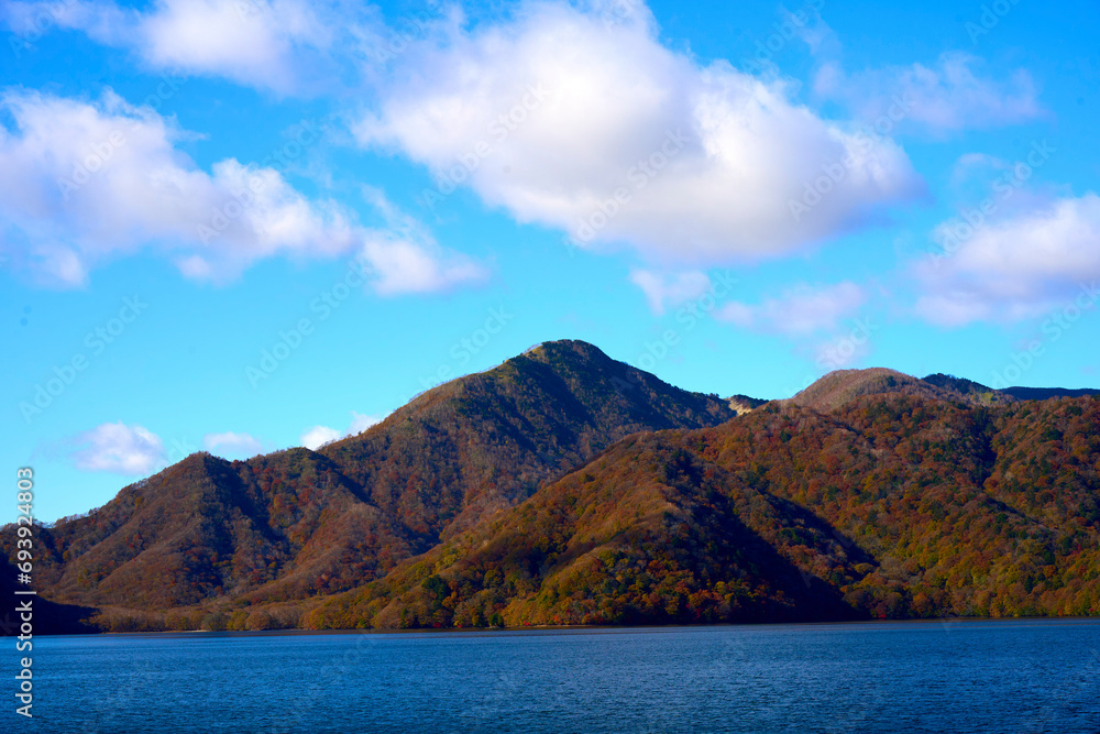 lake and mountains in fall , tochigi japan lake and mountains in fall , tochigi japan