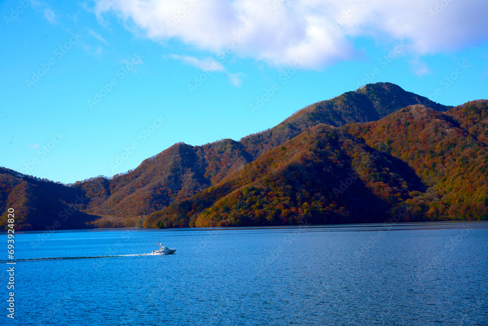 lake and mountains in fall , tochigi japan