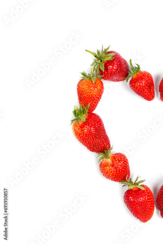 Heart of fresh strawberries on a white background