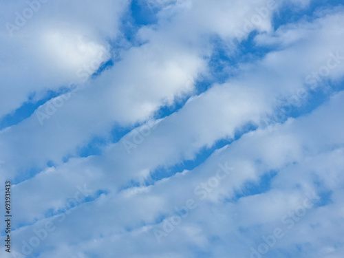 abstract blue sky high big shape clouds background in summer gradient light beauty background. beautiful bright altocumulus cloud and calm fresh wind air