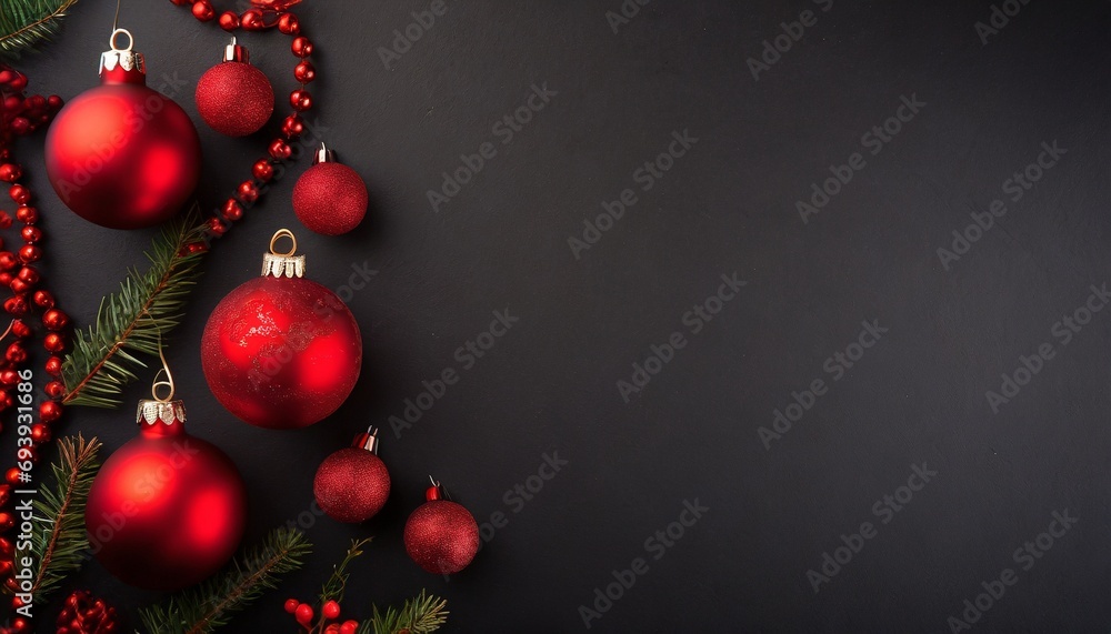 Red Christmas baubles decoration on black background with copy space Red Christmas baubles decoration on black background with copy space