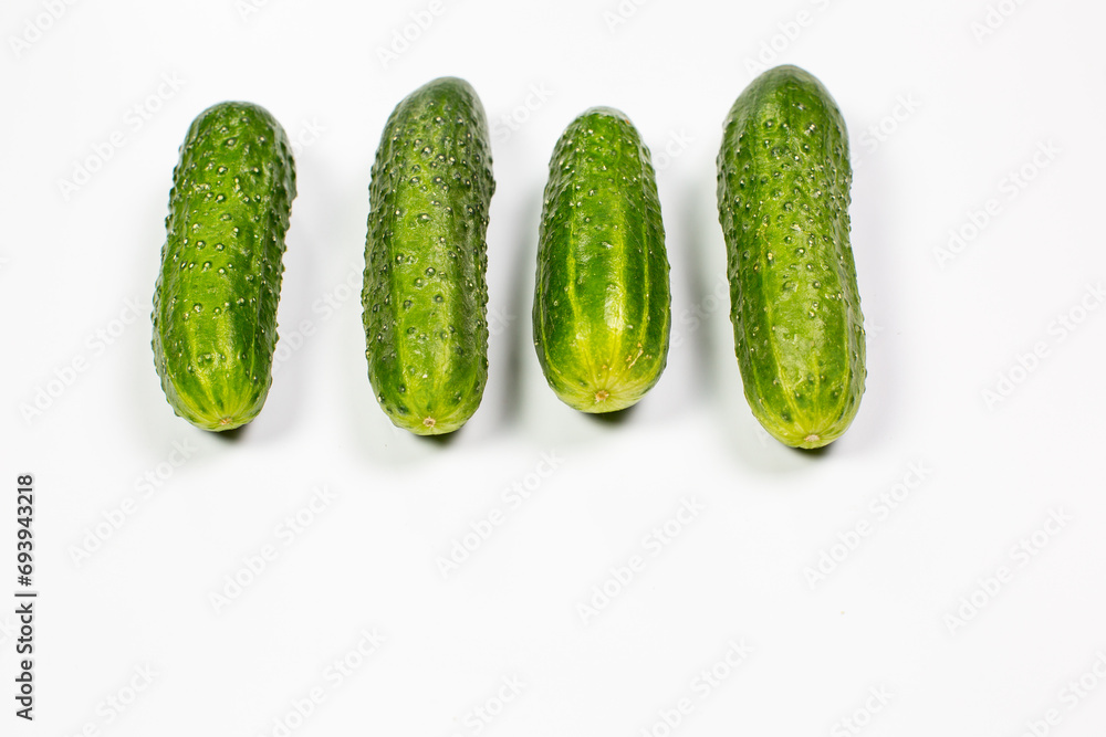 Fresh green cucumbers on white background Fresh green cucumbers on white background
