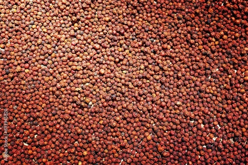 asian red peppercorns drying in the sun