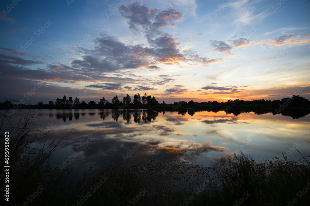 Fototapeta premium Beautiful vivid sunset with sky and cloud