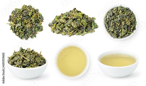 collection of loose leaves and bowls of brewed Chinese tea isolated on white photo