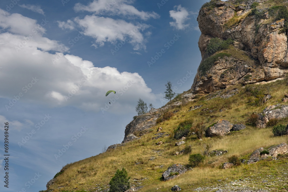 Russia. North Caucasus, Kabardino-Balkaria. Paragliding flight over the picturesque cliffs of the Chegem gorge. Russia. North Caucasus, Kabardino-Balkaria. Paragliding flight over the picturesque cliffs of the Chegem gorge.