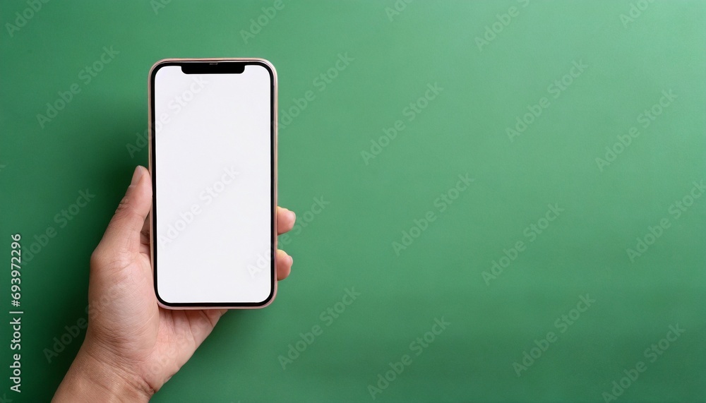 Hand using smartphone with blank screen, isolated on green background Hand using smartphone with blank screen, isolated on green background