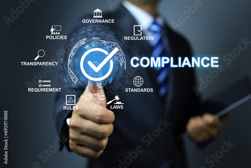 Compliance concept with businessman thumb up checkmark to applied standard and regulation for export products to foreign countries to meet government trade requirement in global business photo