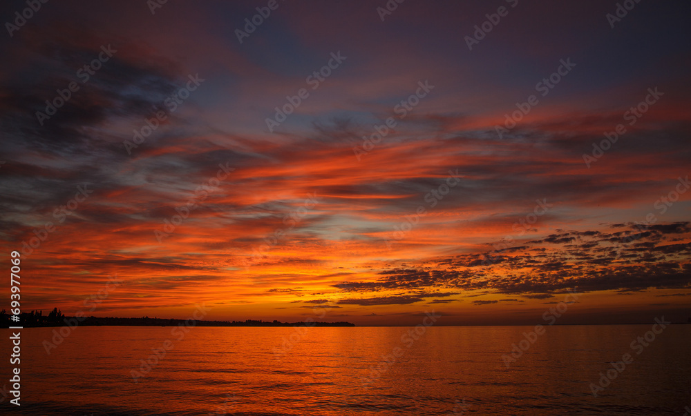 Beautiful orange sunrise over the river with beautiful clouds