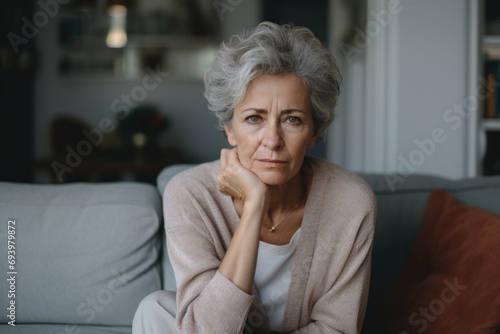 Portrait of a worried senior woman at home