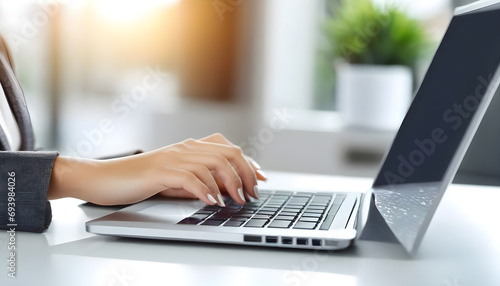 Business-woman-working-on-modern-computer-banner-or-panorama.-Person-buying-online-at-internet.-Laptop-focused-on-keyboard-detail-with-blur-hand.-copy-space-for-text