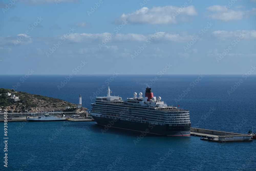 Classic british luxury ocean liner cruiseship cruise ship in Ibiza port with red, black and white hull