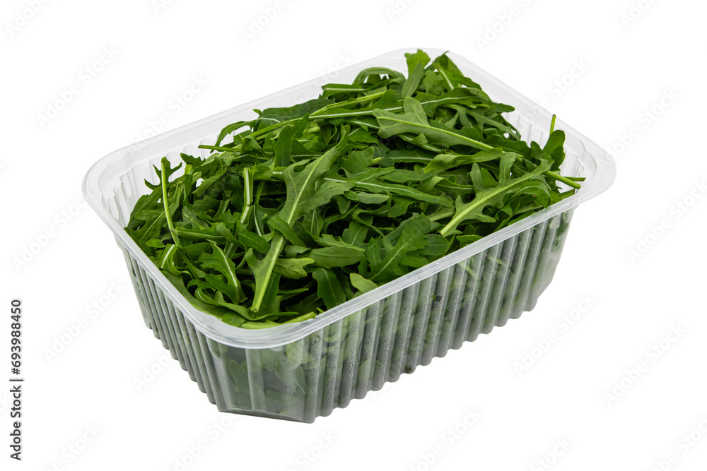 Fresh arugula leaves in container on white isolated Fresh arugula leaves in container on white isolated