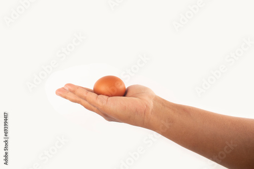 an egg in the palm of his hand photo