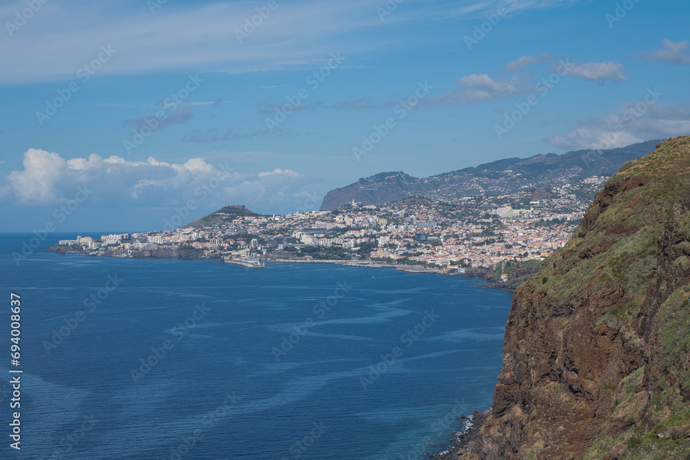 Canico, Madeira, Portugal – September 24 2023: Looking out over the bay of Funchal from Miradouro do Cristo Rei, Ponta do Garajau, on an early autumn day.