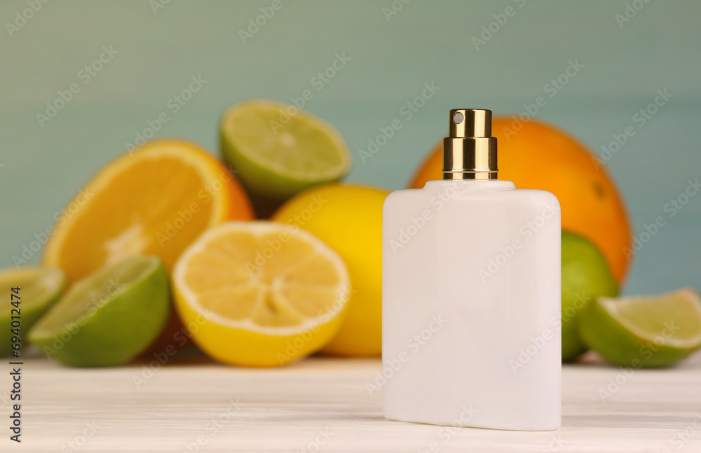Perfume with citrus extracts. Selective focus. Spa day, concept of freshness perfume bottle with lemon lime and orange slices Perfume with citrus extracts. Selective focus. Spa day, concept of freshness perfume bottle with lemon lime and orange slices