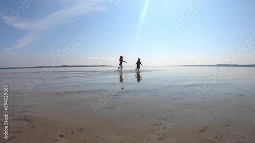 Children playing in the water of the Baltic Sea in North Germany