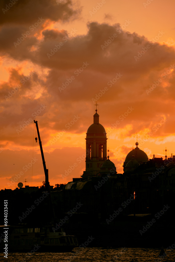 sunset over the cathedral. St. Petersburg, Russia. Orthodox church and Yacht during the sunset
