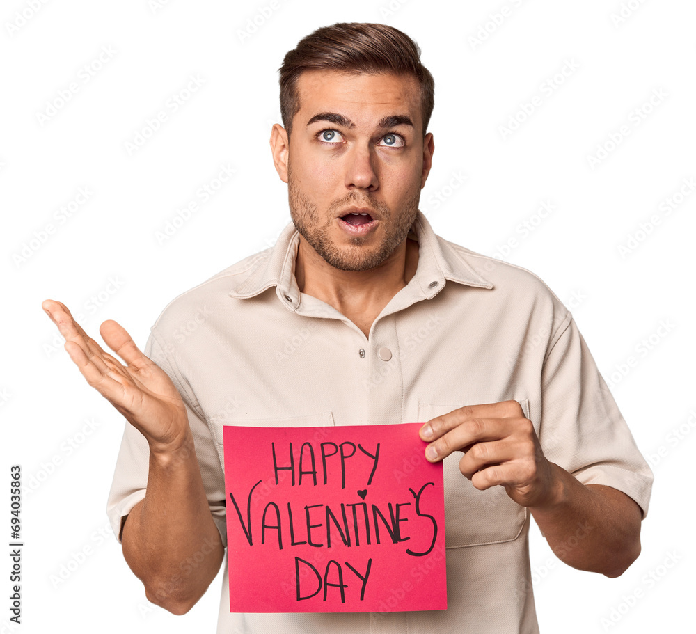 Young man with Valentine's sign surprised and shocked. Young man with Valentine's sign surprised and shocked.