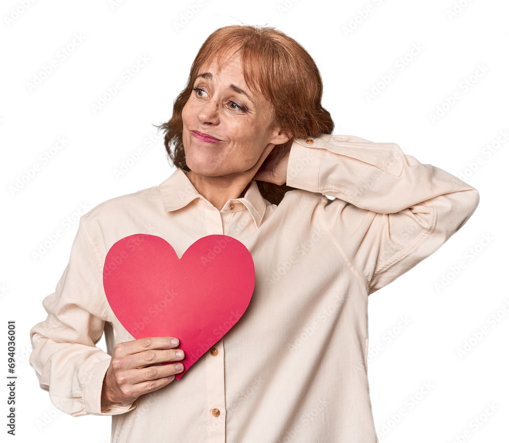 Middle-aged Caucasian woman with Valentine's heart expressing emotions Middle-aged Caucasian woman with Valentine's heart expressing emotions