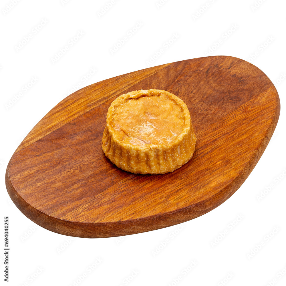 Soft cheese baked on a wooden board on a white background, isolated Soft cheese baked on a wooden board on a white background, isolated