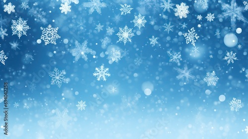 Beautiful snowflakes  lights and bokeh on blue gradient winter background.