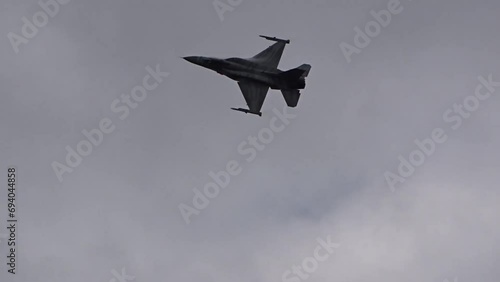 Fighter Jet fighter f16 F 16 full power flypast at air base photo
