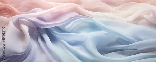 A background of crumpled delicate transparent fabric in warm pastel-colored blue, orange, and violet shades, gathered in waves. A sense of calm and elegance. elegant design.Ultra-wide panoramic banner photo