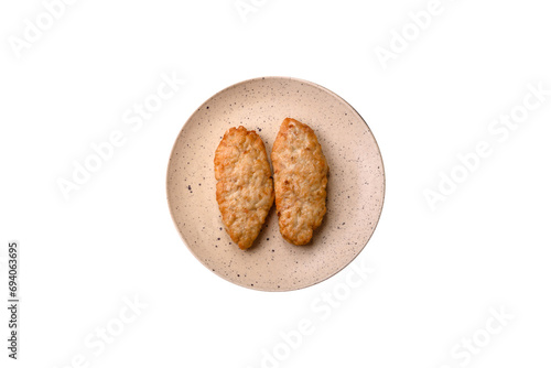 Delicious fresh fried minced fish or chicken cutlets with spices and herbs