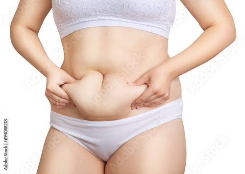 Woman holding her own belly fat.