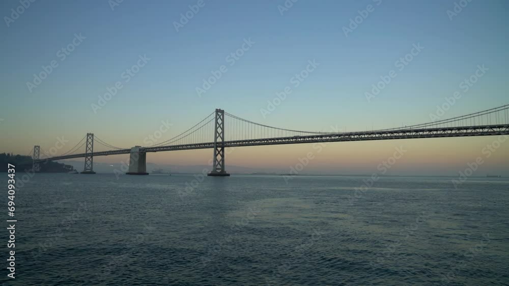 Panoramic view of San Francisco Bay bridge during sunset in California, United States Panoramic view of San Francisco Bay bridge during sunset in California, United States