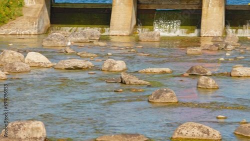 Sandfield Dam view and Manitou River with rocks, Lake Manitou, Manitoulin Island, Northern Ontario, Canada. Summer ambiance and charming view. Travel, adventure and exploring. photo