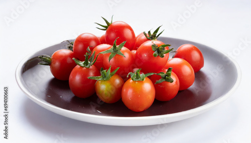 cherry tomatoes on a plate isolated on white