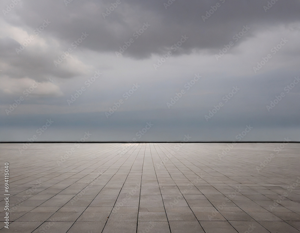 The horizon and the cloudy sky as a background, in the foreground an empty square