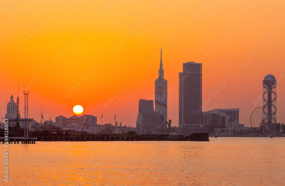 City embankment in Batumi during a picturesque sunset.