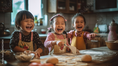 Cute children enthusiastically making cakes in the kitchen