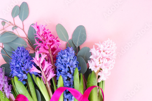 wedding or mothers day background  bouquet of Hyacinth flowers over plain pink background