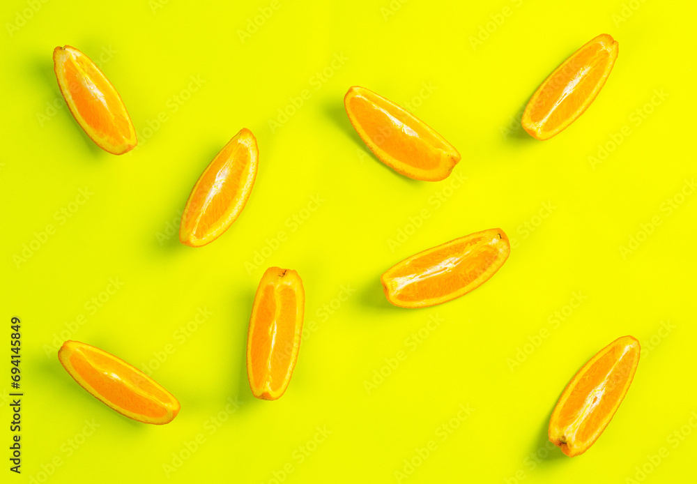 Orange orange slices on yellow background Orange orange slices on yellow background