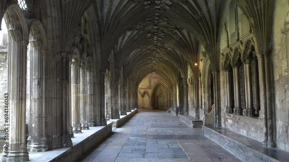 POV: Beautiful cloister with gothic arches in magnificent Canterbury Cathedral. Stunning architectural details of a religious and pilgrimage building in England, which is under UNESCO protection. POV: Beautiful cloister with gothic arches in magnificent Canterbury Cathedral. Stunning architectural details of a religious and pilgrimage building in England, which is under UNESCO protection.