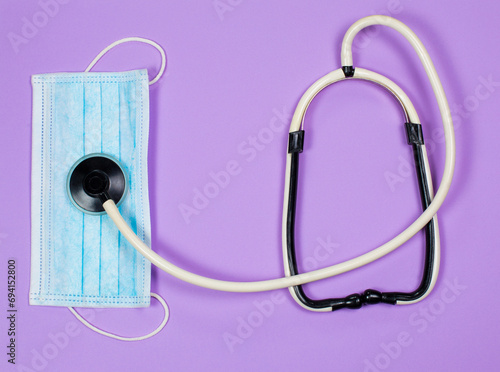 Medical instruments on purple background, doctor tools for treating people from illness