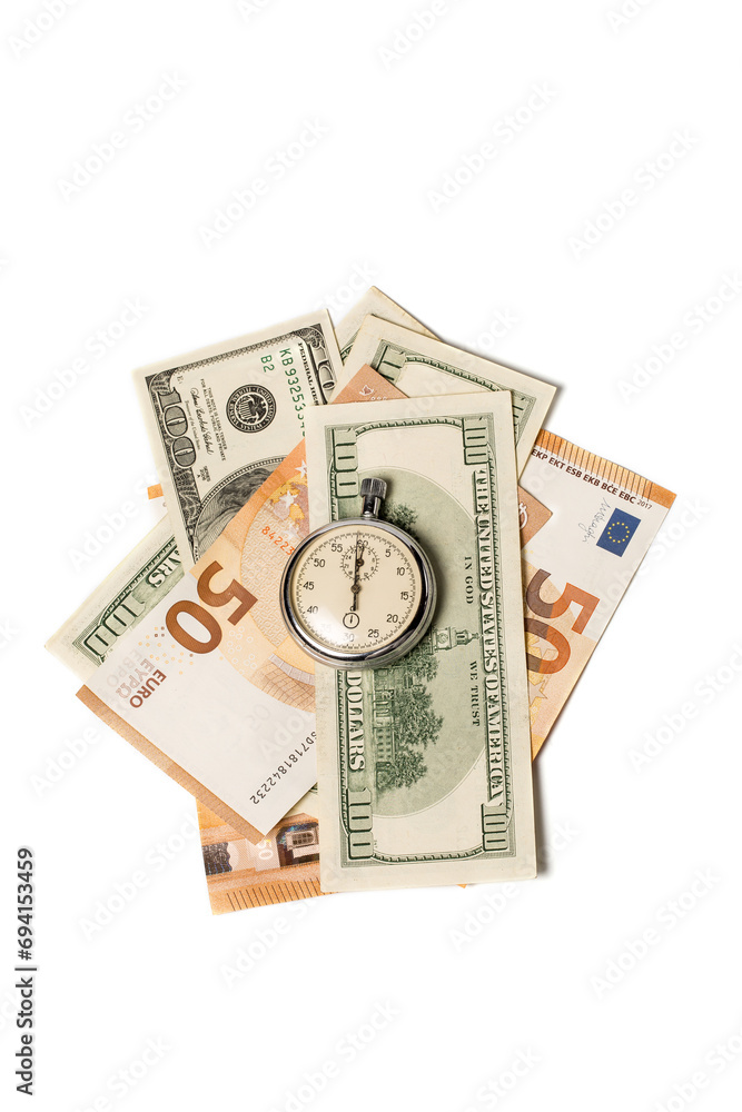 Stopwatch and a lot of different money, time is money Stopwatch and a lot of different money, time is money